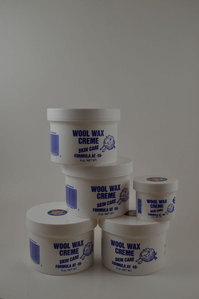 4 Nine ounce jars and 1 two ounce jar Wool Wax Creme